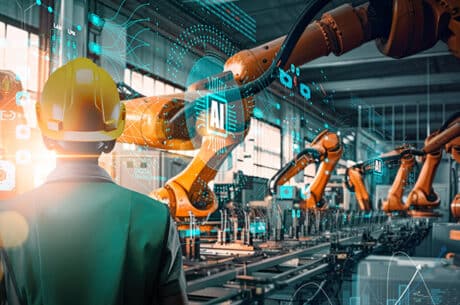 Factory Female Industrial Engineer working with Ai automation robot arm
